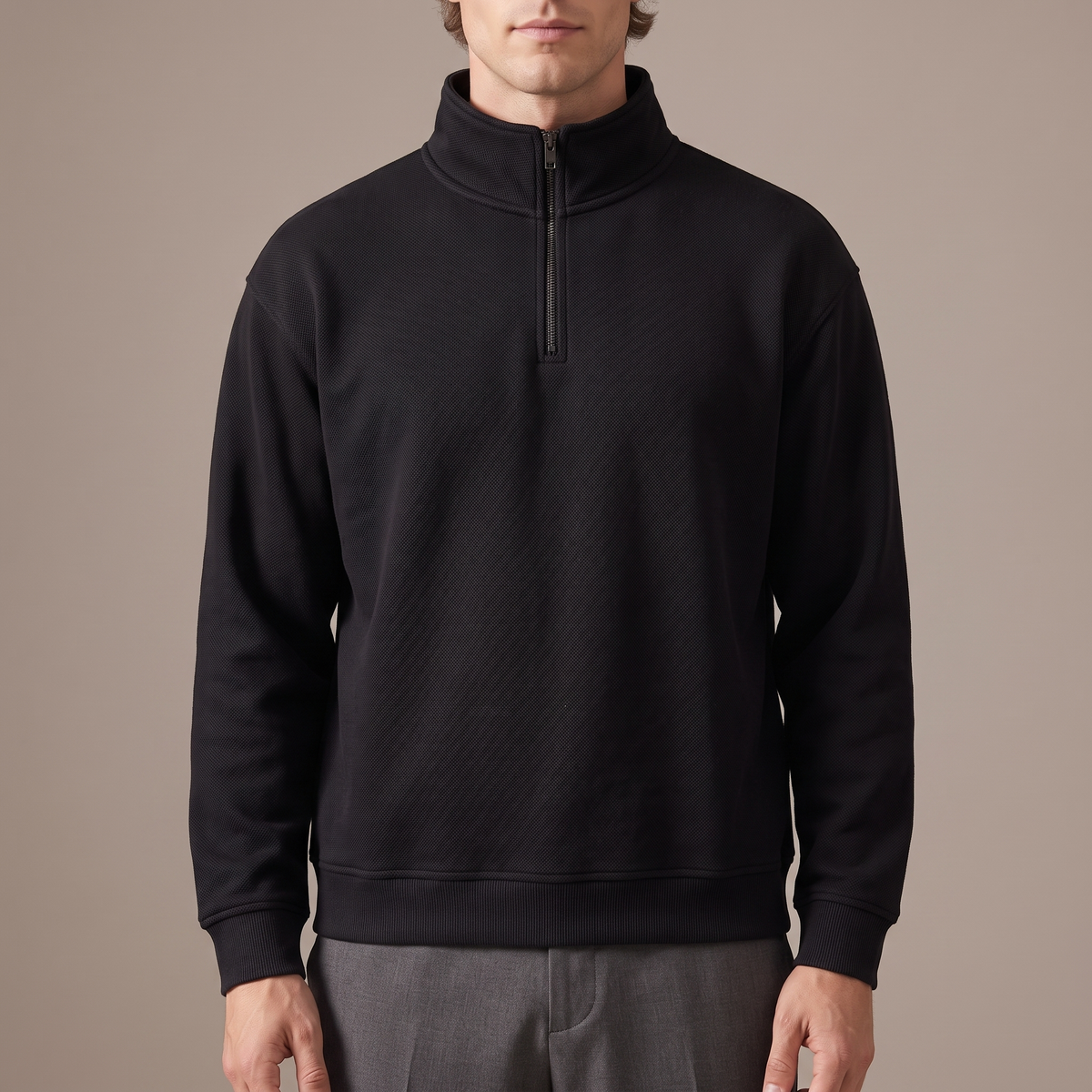 Close detail of the stand collar and half zip on the pique sweatshirt, in black