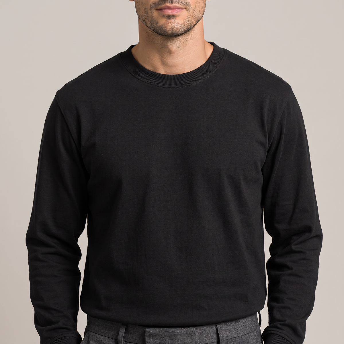 Close detail of the ribbed crew neck on the combed cotton long sleeve t-shirt, in black