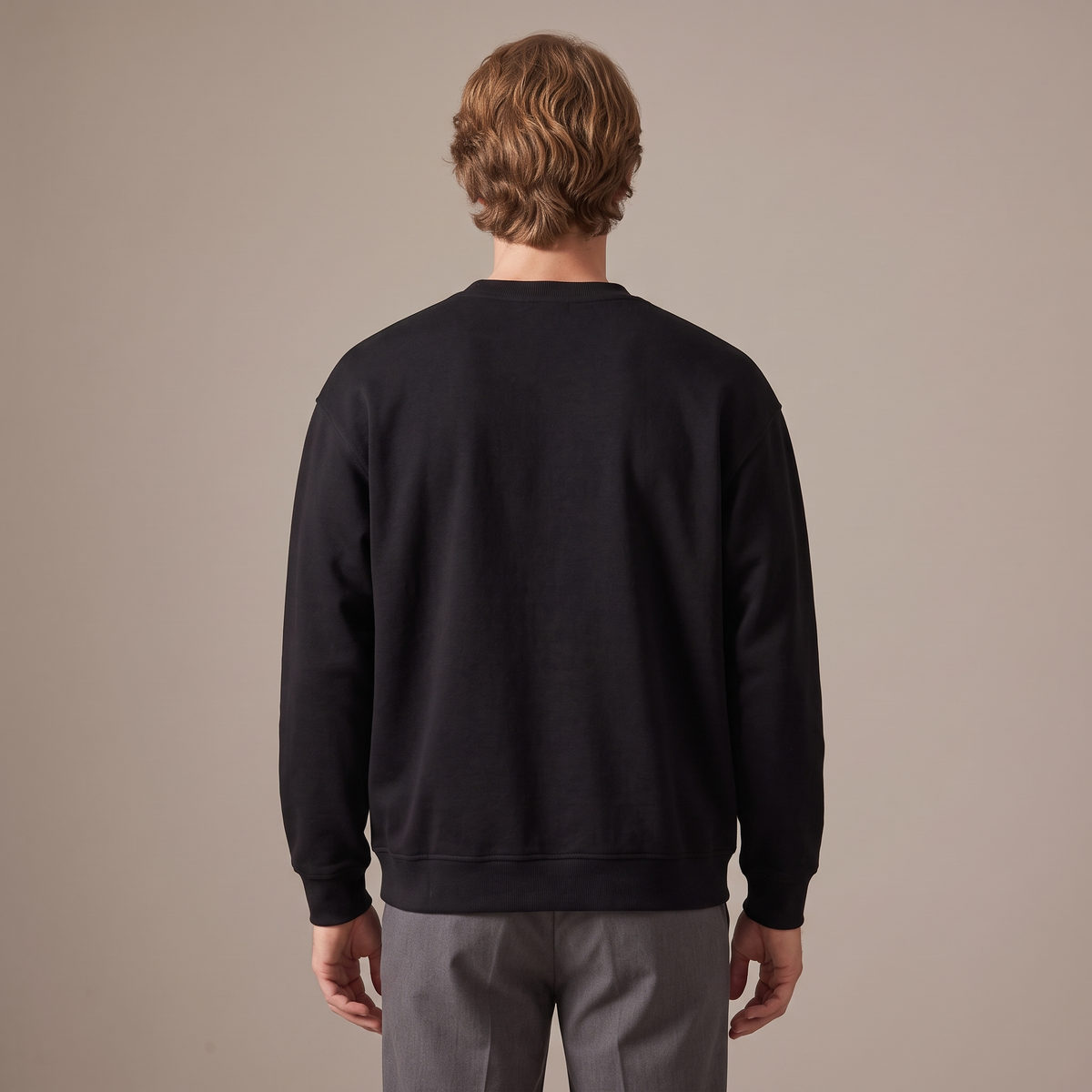 Men's black oversized terry sweatshirt, back view