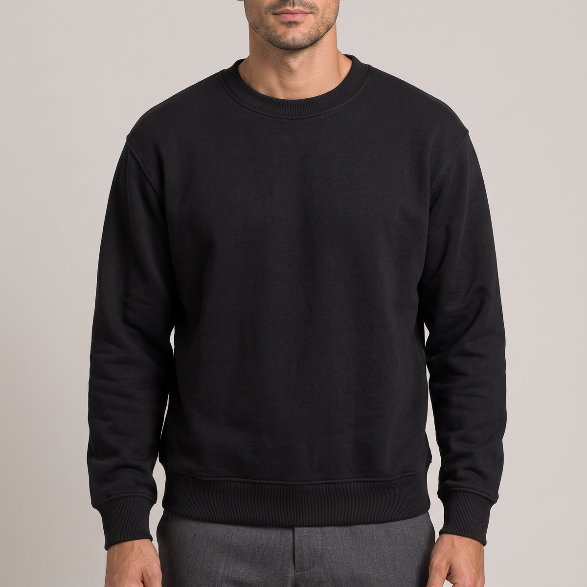 Close detail of the ribbed crew neck on the cotton terry sweatshirt, in black
