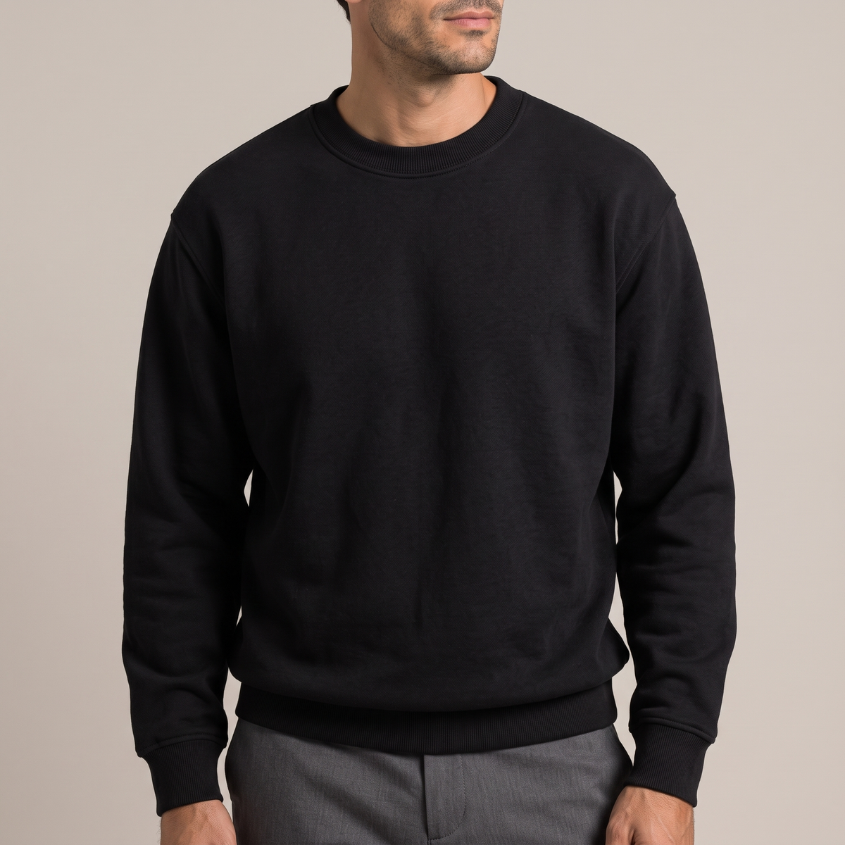 Close detail of the thick ribbed crew neck on the heavyweight terry sweatshirt, in black