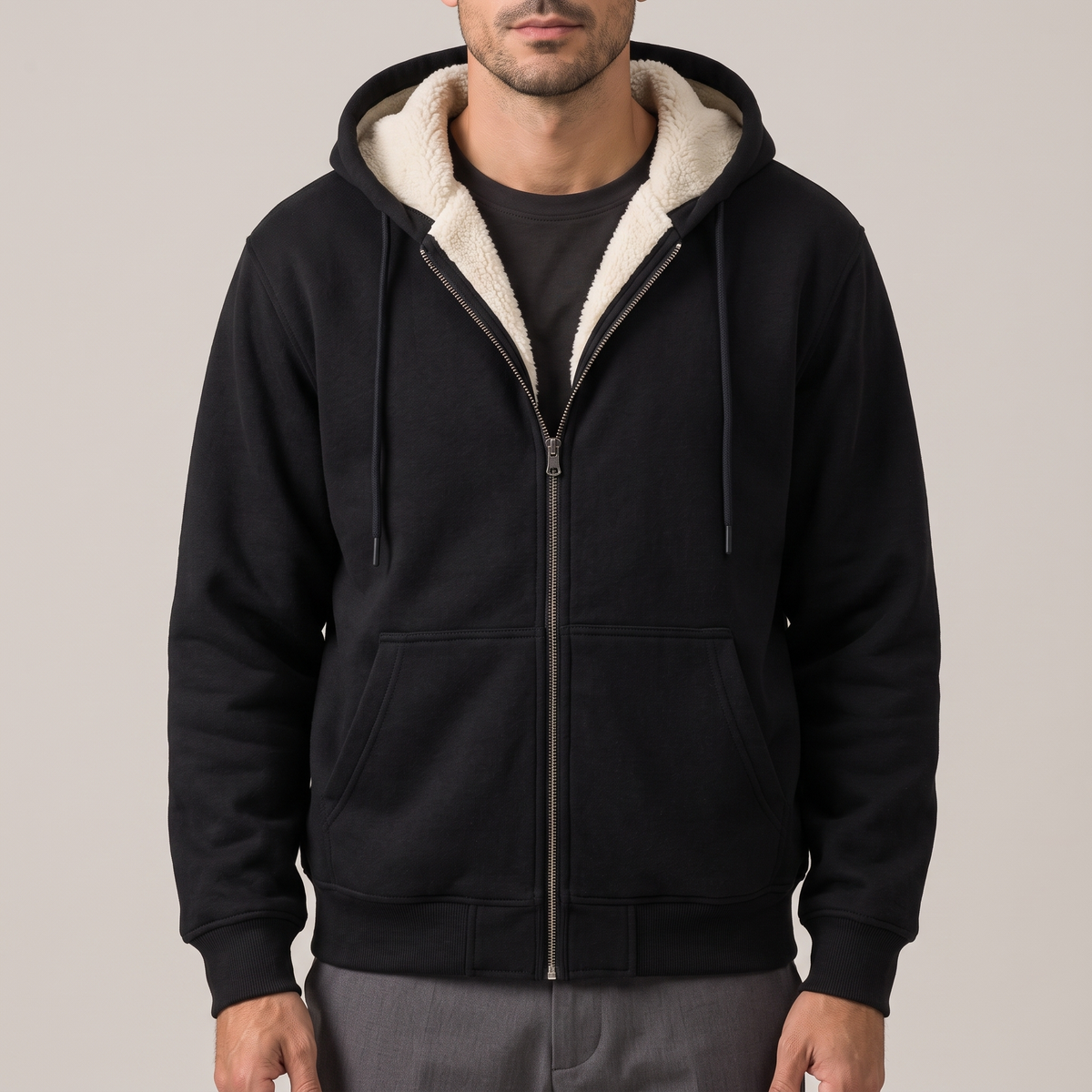 Close detail of the sherpa lining at the hood and zip, in black