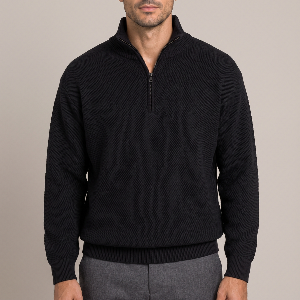 Close-up of the stand collar and half-zip detail, in black