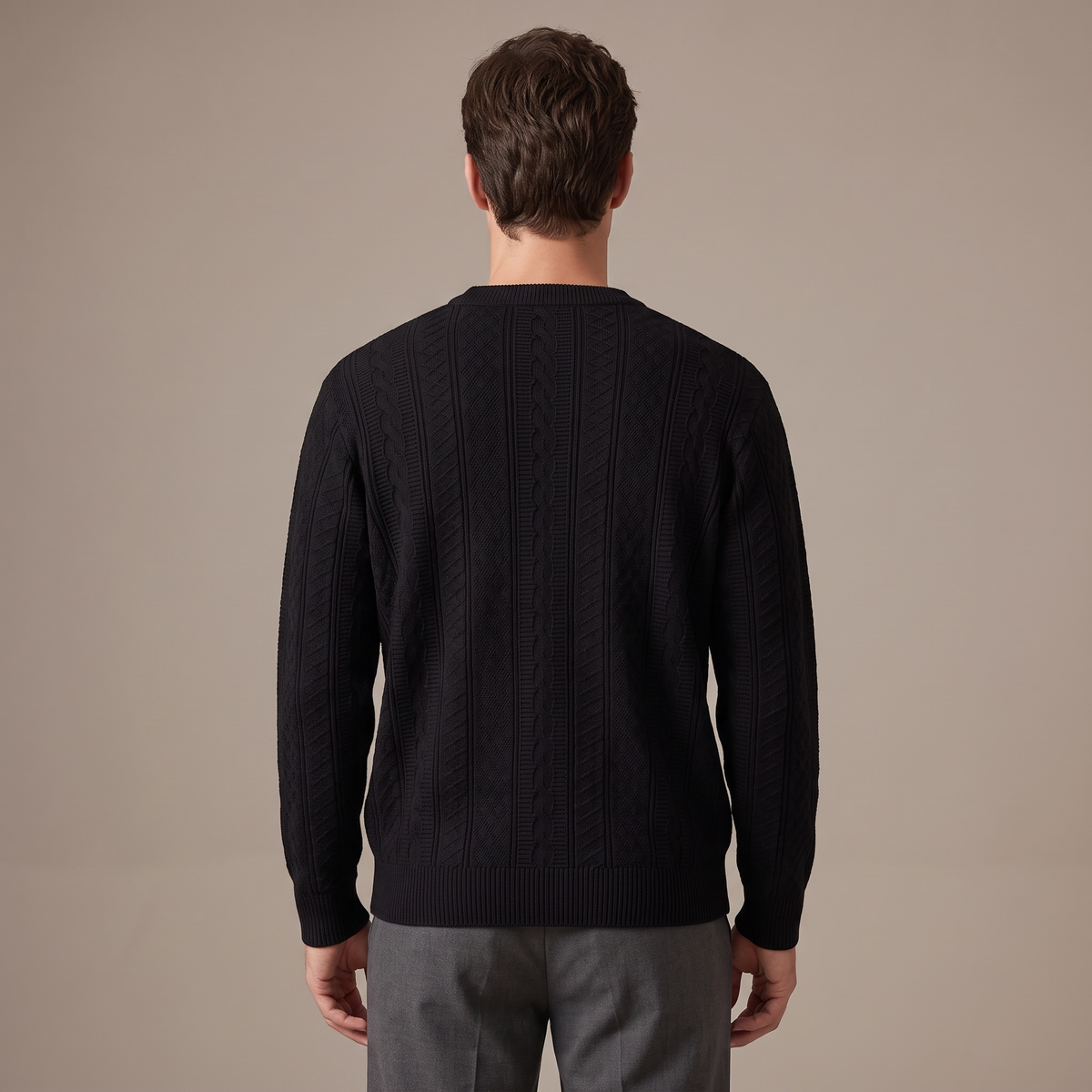 Back view of the cable knit jumper in black