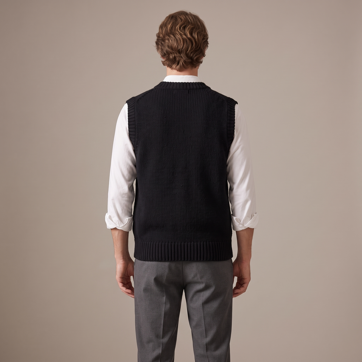 Back view of the thick wool knitted vest in black