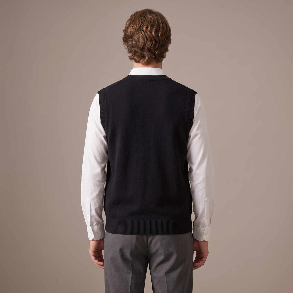 Back view of the wool knitted vest in black