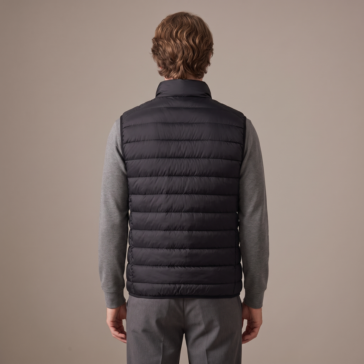 Back view of the duck down gilet in black