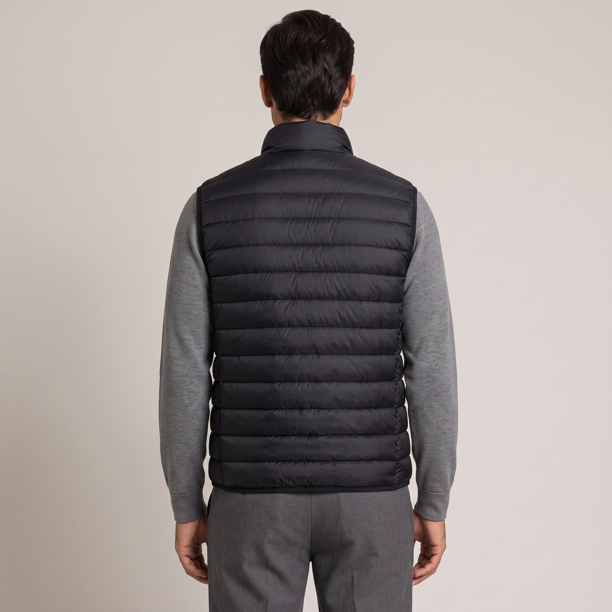Back view of the layering down gilet in black