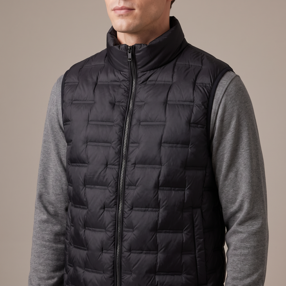 Close-up of the stand collar, zip and quilting, in black