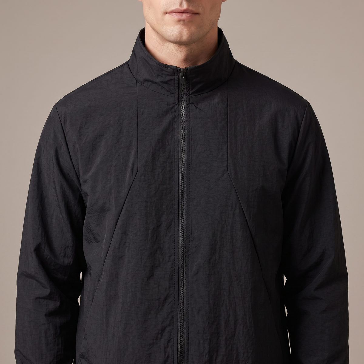 Close-up of the tall stand collar and zip, in black