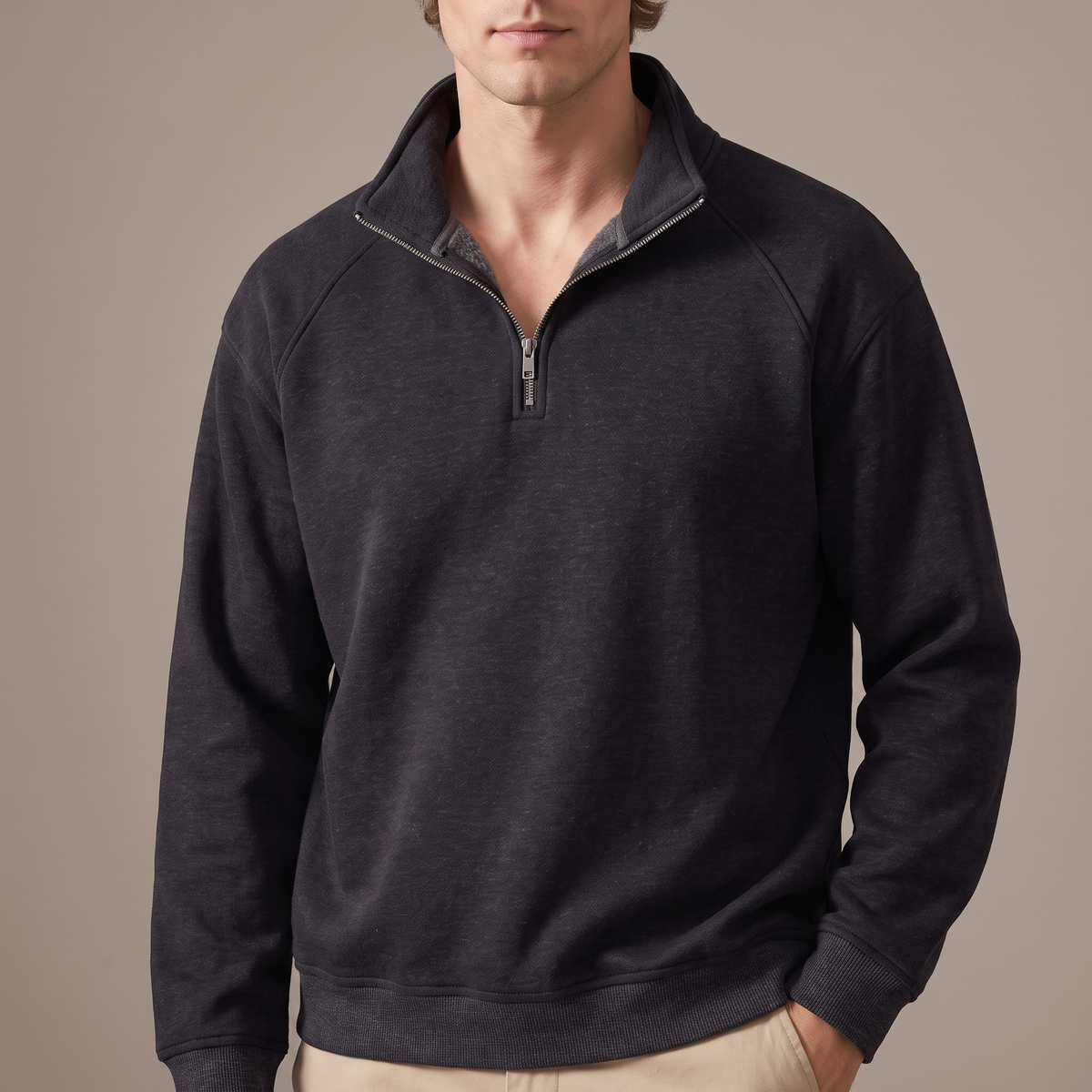 Close-up of the stand collar and half zip, in charcoal