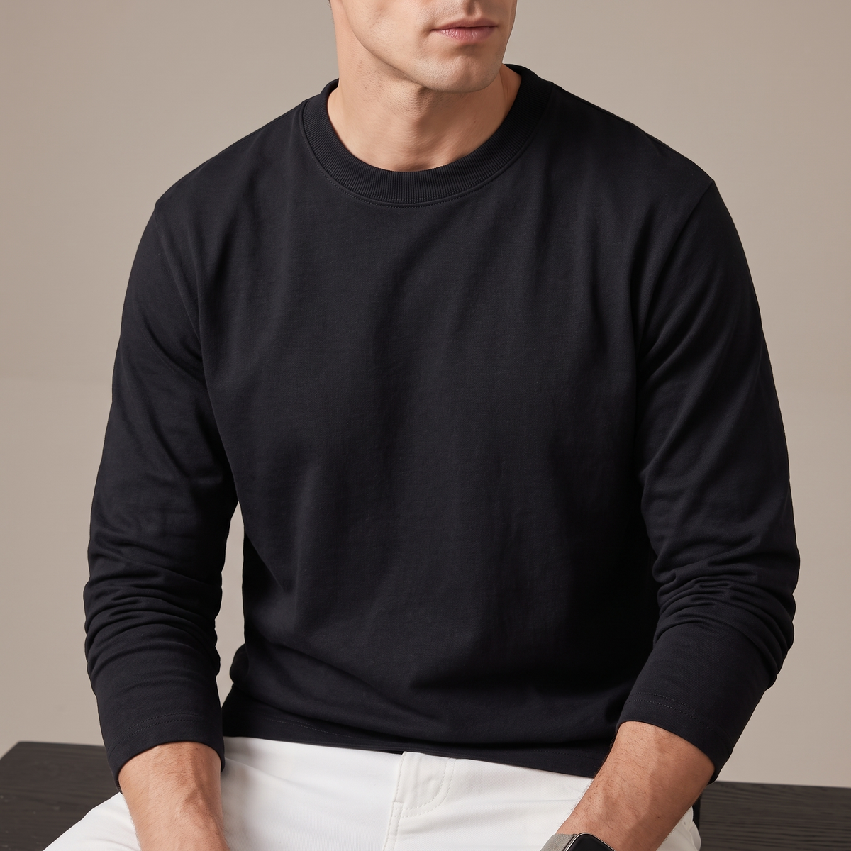 Close-up of the ribbed crew neckline and dense jersey, in black
