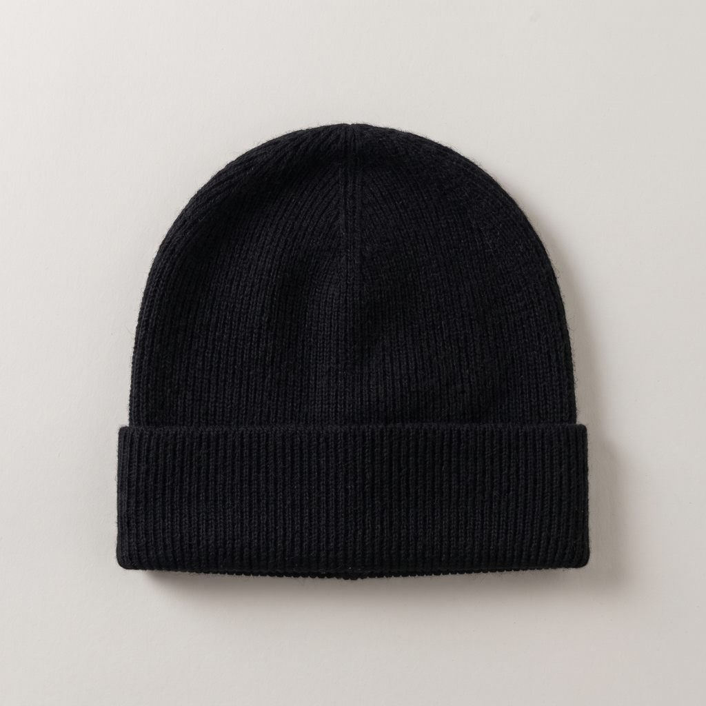 Close flat lay of the wool beanie showing the rib knit, in black
