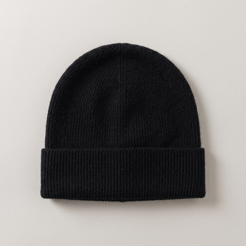 Close flat lay of the wool beanie showing the rib knit, in black
