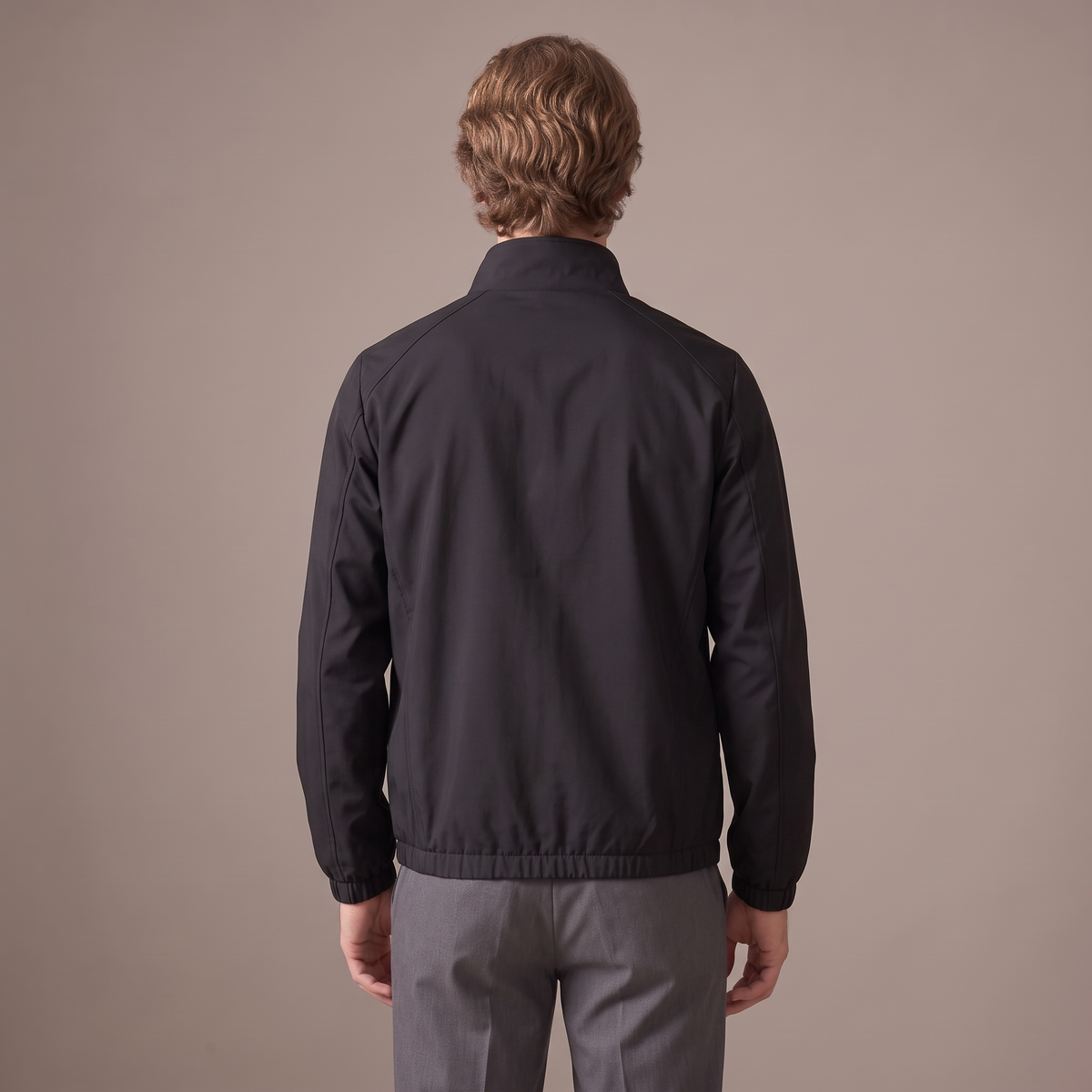 Back view of the windbreaker jacket in black