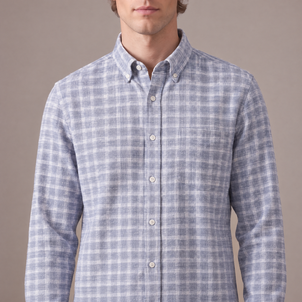 Close-up of the brushed flannel check, placket and chest pocket, in light blue check